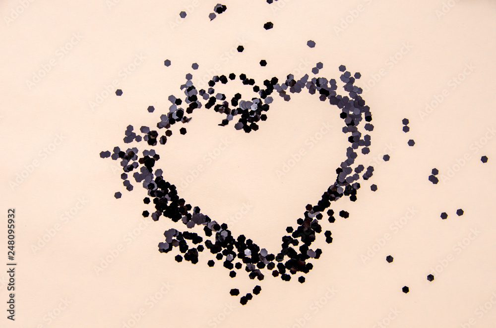 heart shape, confetti splash with black heart frame inside, valentines day background greeting card. many small dots on a background, heart shape, confetti splash with black heart frame inside, valentines day background greeting card. many small dots on a background,