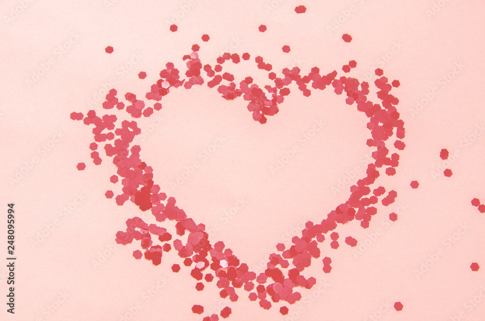 red glitter hearts on a white background for Valentine's Day