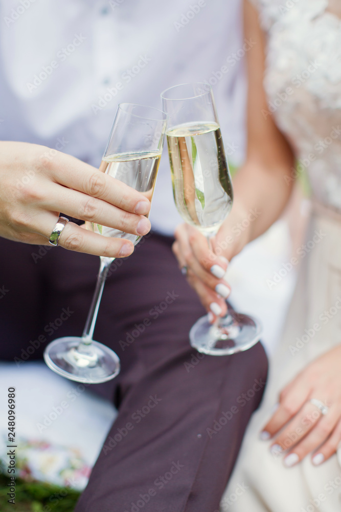 couple holding glasses with champagne