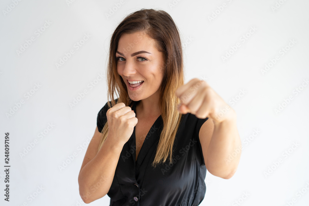 Joyful pretty woman standing in boxing pose Joyful pretty woman standing in boxing pose