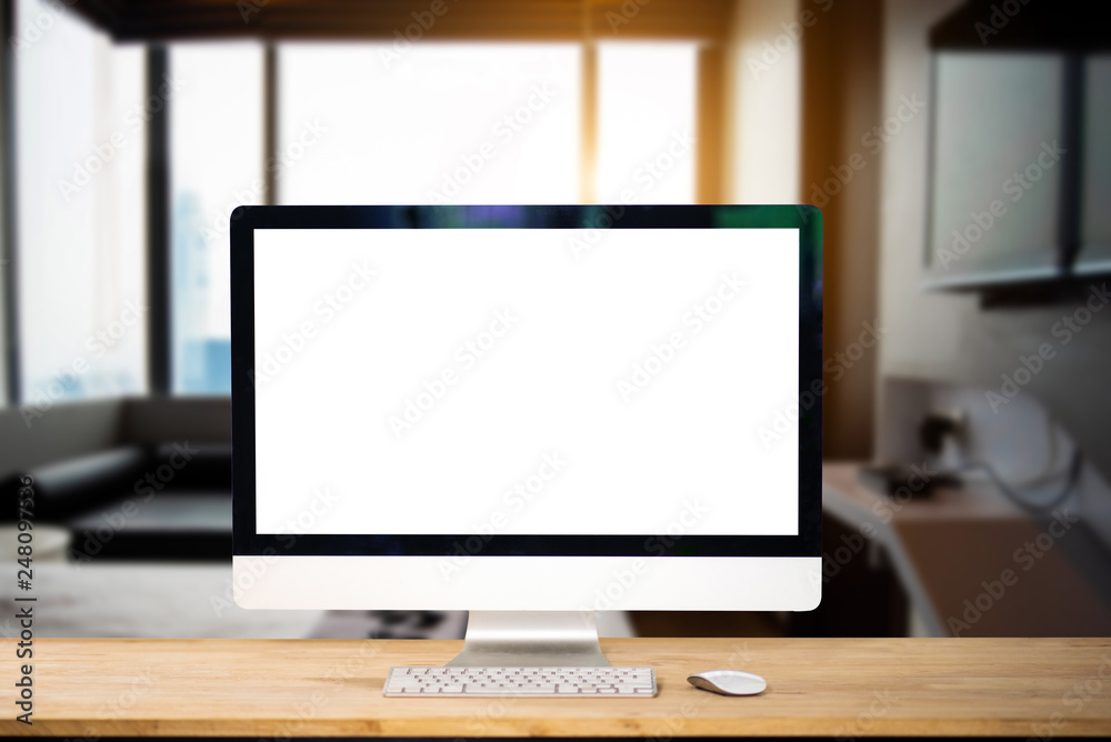 Workspace with computer Monitor, Keyboard, blank screen coffee cup smartphone, and tablet on a table or White Screen Isolated in bright office room interior. Workspace with computer Monitor, Keyboard, blank screen coffee cup smartphone, and tablet on a table or White Screen Isolated in bright office room interior.