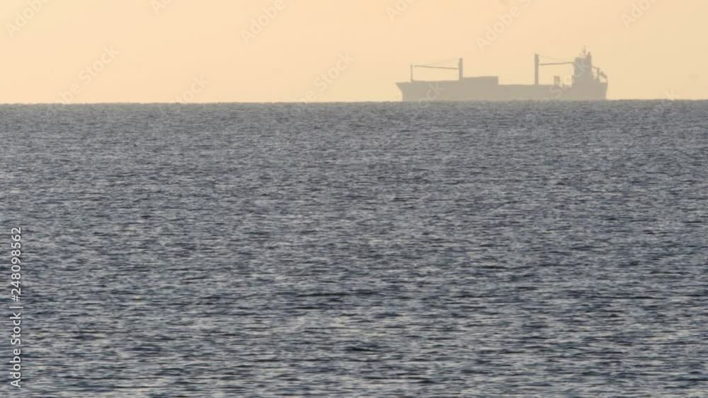 big cargo ship in the open sea at sunset, sea freight big cargo ship in the open sea at sunset, sea freight
