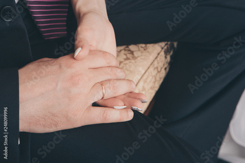 hands close-up: a man holding a woman's hand. Valentine's day: bride and groom © aaalll3110