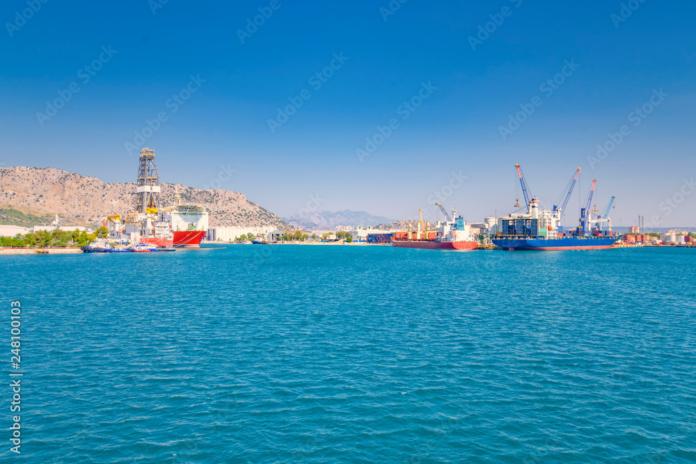 sea cargo port for loading container ships, on the Mediterranean coast, cranes, containers, ships
