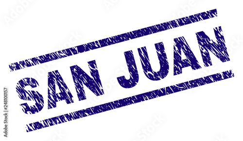 SAN JUAN seal watermark with distress style. Blue vector rubber print of SAN JUAN title with grunge texture. Text title is placed between parallel lines.
