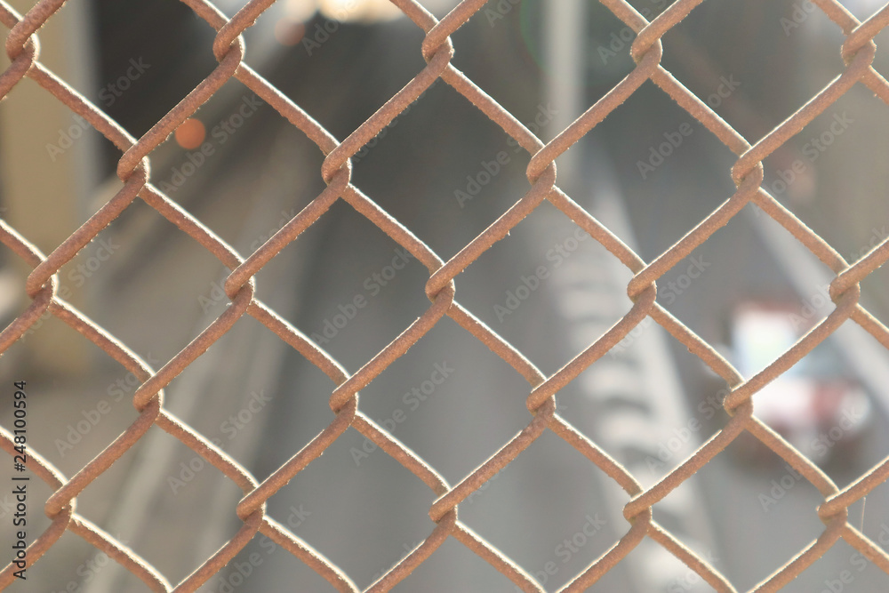 Close up Wired Fence and Blurred Background Car Traffic