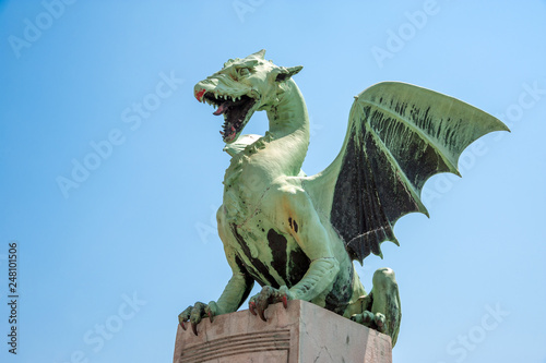 Dragon stature, the symbol of Slovenian capital, by Dragon bridge  in the center of Ljubljana, Slovenia