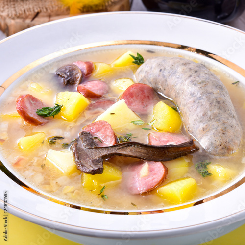 a polish easter soup with homemade white sausage and mushrooms photo