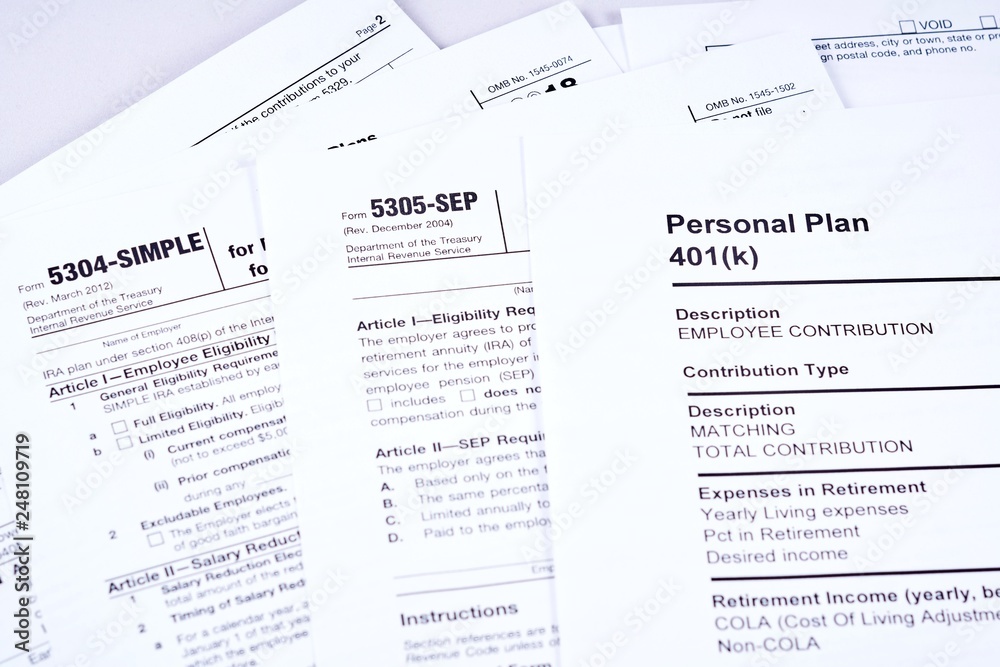 Fototapeta premium Tax reporting and retirement plan. Personal plan 401k form on against background 5304-simple, 53050-sep tax form and light background
