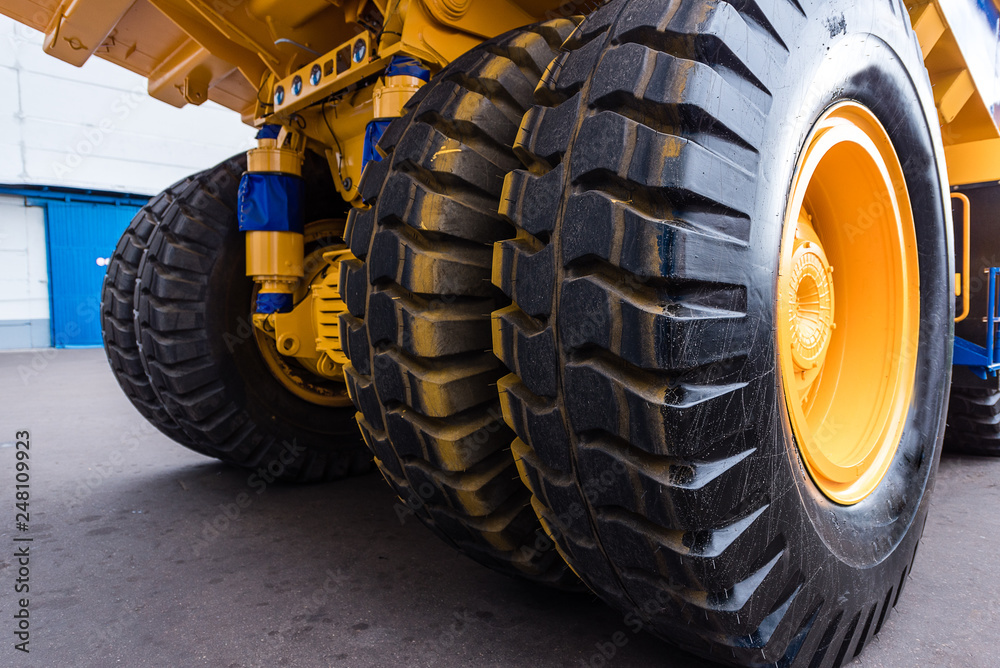 Huge wheels of a yellow dump truck Huge wheels of a yellow dump truck