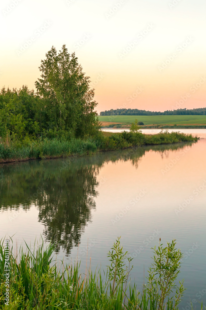 Nature and landscape of Russia. Journey through the Saratov region, the Volga region. Early morning, dawn on the lake in good summer sunny weather.