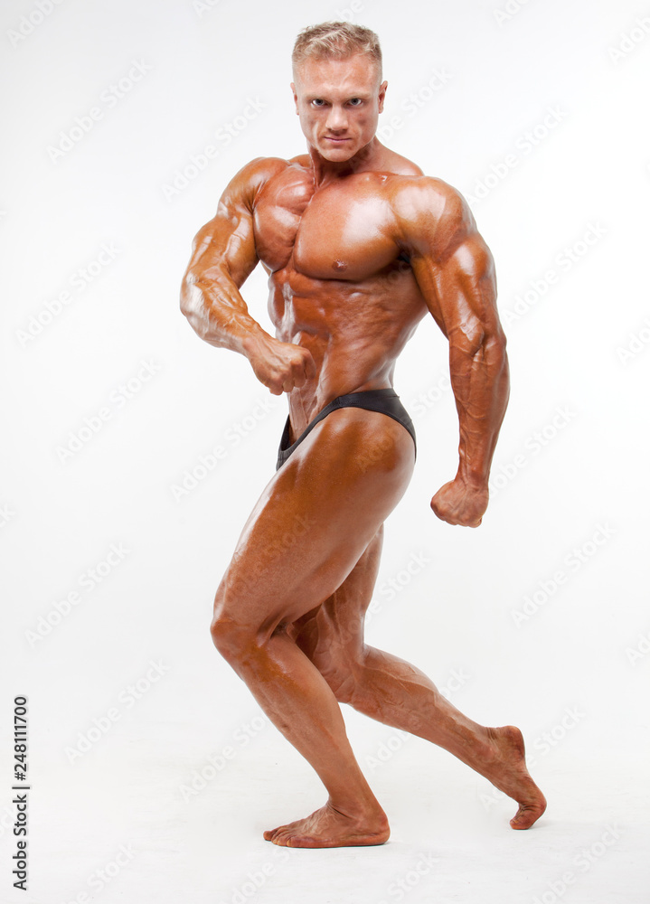 Body builder posing in studio Body builder posing in studio