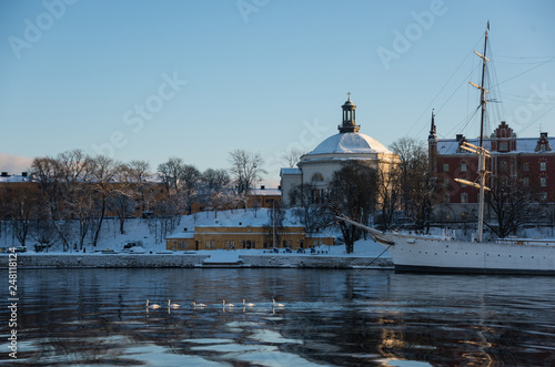 A cold winter morning in Stockholm with snow and ice on islands and boats