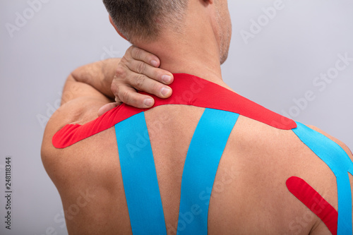 Rear View Of Man With Physio Tape