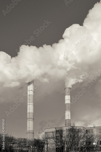 Stream of smoke from the chimney of factory. Toned image