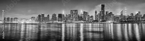 Black and white New York City panorama at night, USA.