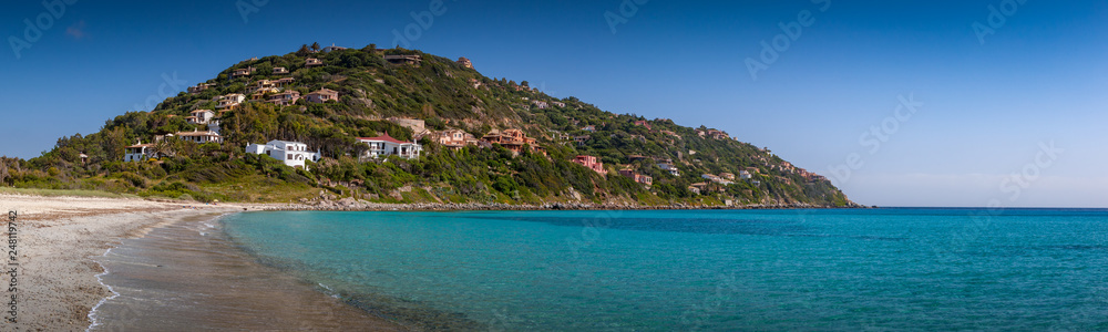 Villas on hill near crystal clear mediterranean sea. Sardinia, Italy
