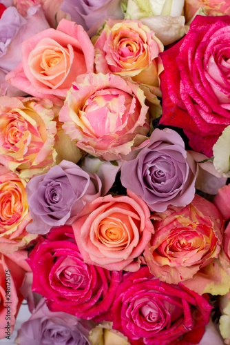 Beautiful bouquet of roses in a gift box. Bouquet of pink roses. Pink roses close-up. on wooden background  with space for text.