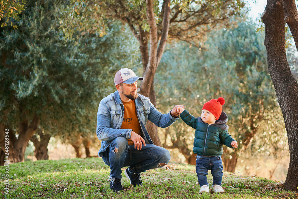 Fototapeta premium Cute little boy learning to walk