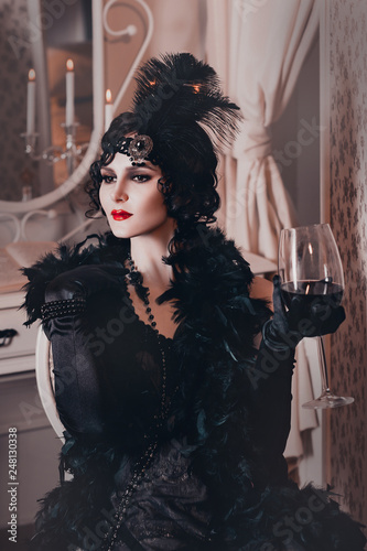 elegant woman in retro style of the 20s, lady flapper in a black dress, dark hair and a bandage, feather boa, long gloves. image of a gangster girl on a party, old fashion. art processing