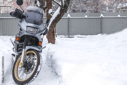 motorcycle on the snow. gloves for bad, cold weather. winter, motorcyclist, extreme ride, adventurer, adventure motorbike, copy space