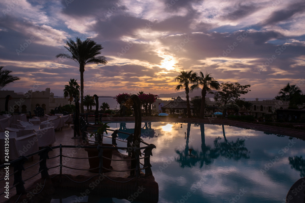 Beautiful sunrise with a view of the pool and the sea. Egypt