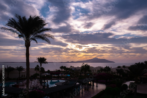 Beautiful sunrise with a view of the pool and the sea. Egypt