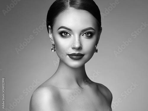 Beautiful Young Woman with Clean Fresh Skin. Perfect Makeup. Beauty Fashion. Eyelashes. Cosmetic Eyeshadow. Highlighting. Cosmetology, Beauty and Spa