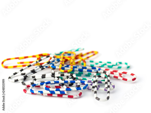 colored paper clips isolated on white background.