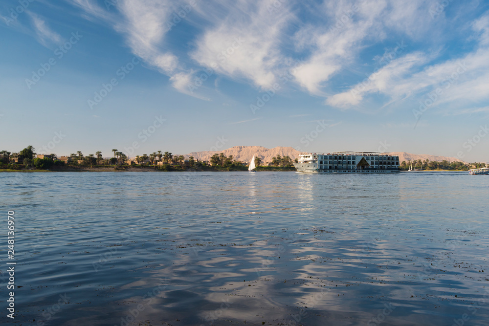 Large egyptian river cruise boat sailing on Nile