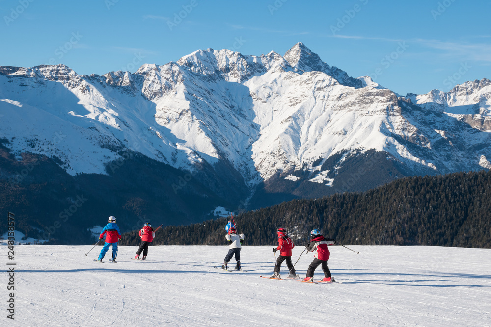 Children skiers in action on the ski slopes of Spiazzi di Gromo, Val Seriana, Lombardy, Italy