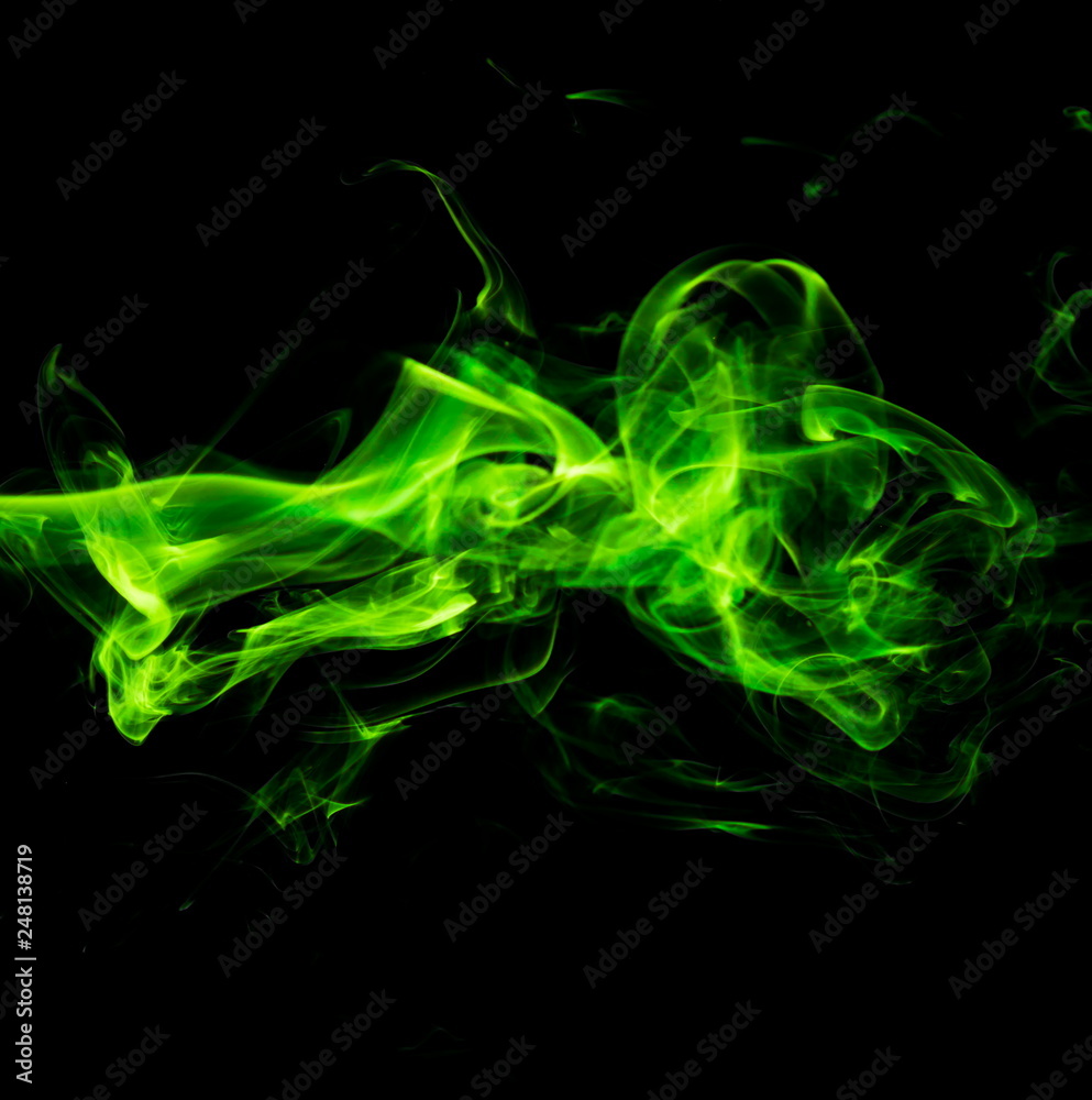 Green smoke on black background Green smoke on black background
