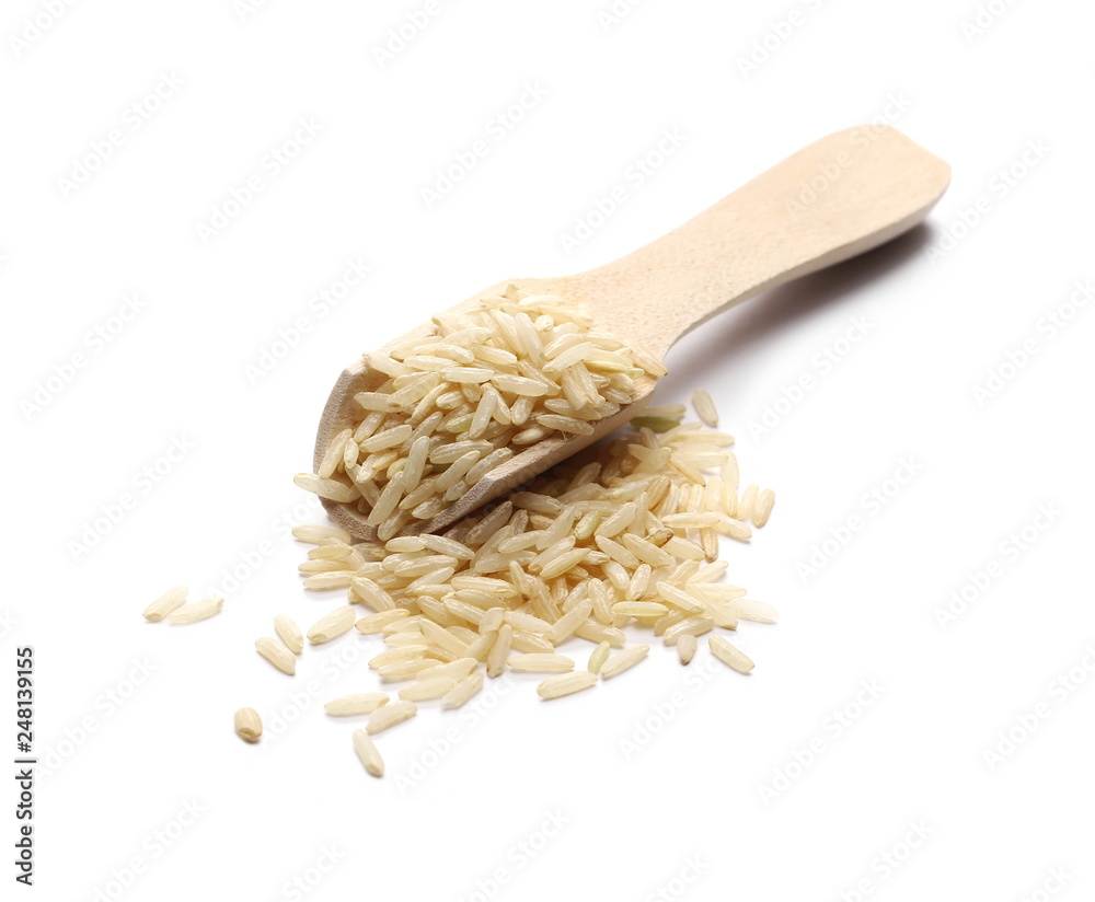Integral long rice pile in wooden spoon isolated on white background Integral long rice pile in wooden spoon isolated on white background
