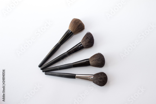 make up brushes isolated on white. make up background. black brushes