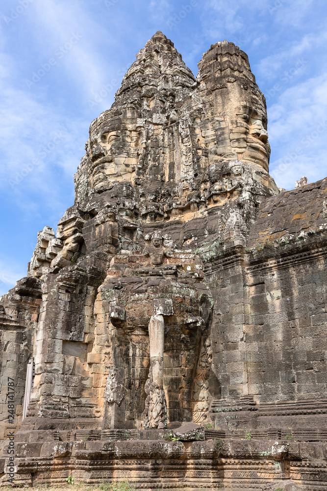 carved faces on South Gate of Angkor Thom, Siem Reap, Cambodia, Asia