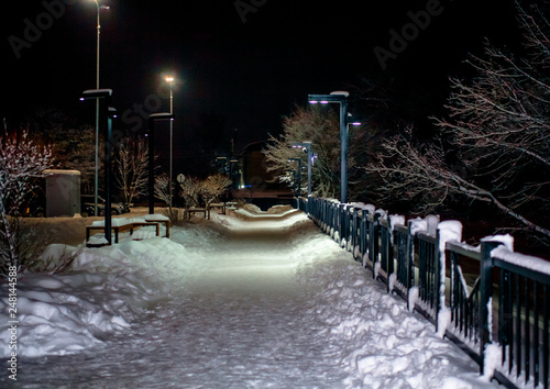 Night view of the snow-covered deserted embankment.