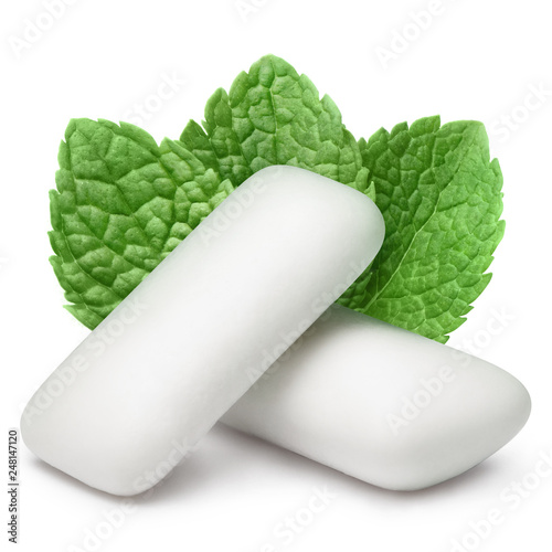 Two chewing gum pieces with fresh mint leaves, isolated on white background photo