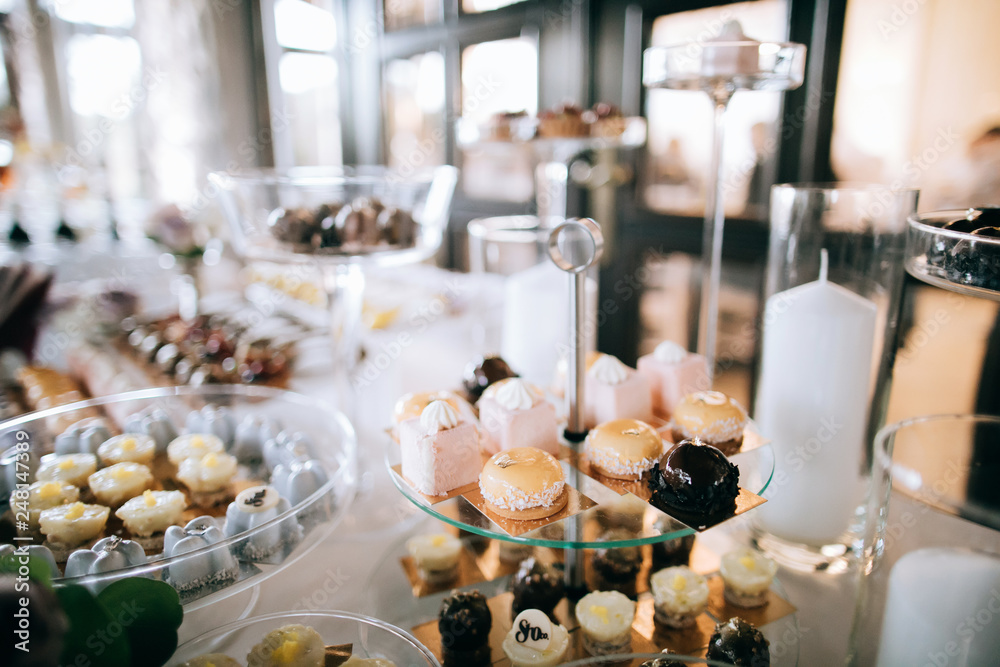 Beautiful sweets and desserts on the wedding table