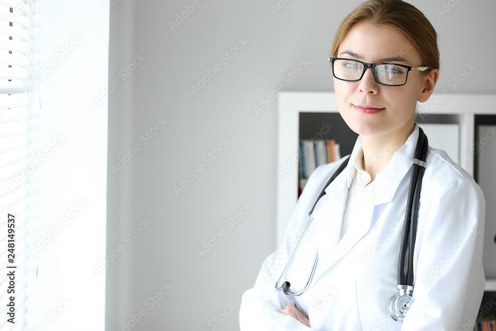 Doctor woman at work. Portrait of female physician at hospital office. Medicine and healthcare concept Doctor woman at work. Portrait of female physician at hospital office. Medicine and healthcare concept