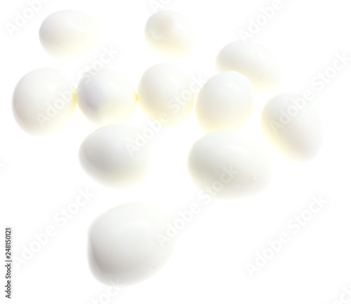 Peeled boiled eggs on a white background