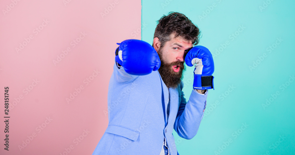 Committed to success. Bearded man in boxing stance. Businessman in formal wear and boxing gloves. Sport improves his leadership skills. Fighting for success in sport and business. Strong and powerful Committed to success. Bearded man in boxing stance. Businessman in formal wear and boxing gloves. Sport improves his leadership skills. Fighting for success in sport and business. Strong and powerful