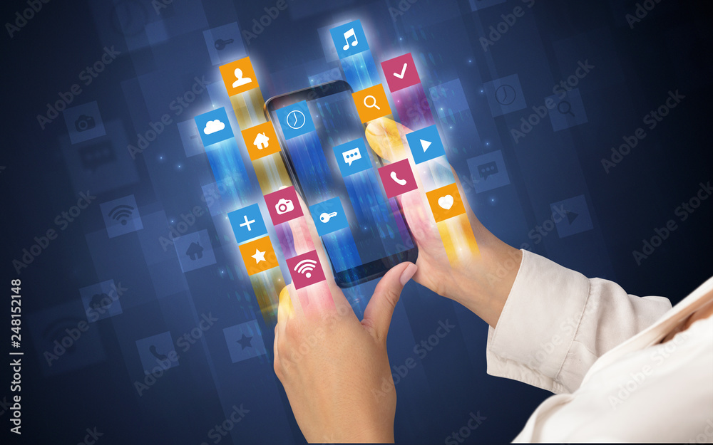 Female hand using smartphone with colorful angular fast switching application icons around Female hand using smartphone with colorful angular fast switching application icons around