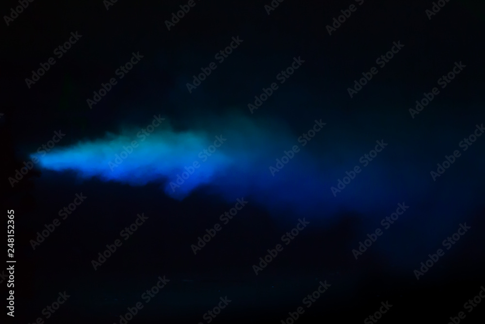Fototapeta premium Blue colorful smoke on a black background