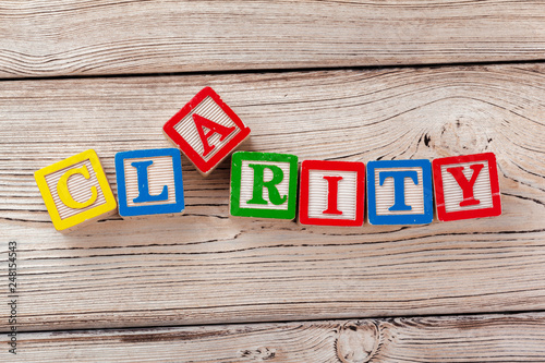 Wooden toy Blocks with the text: clarity