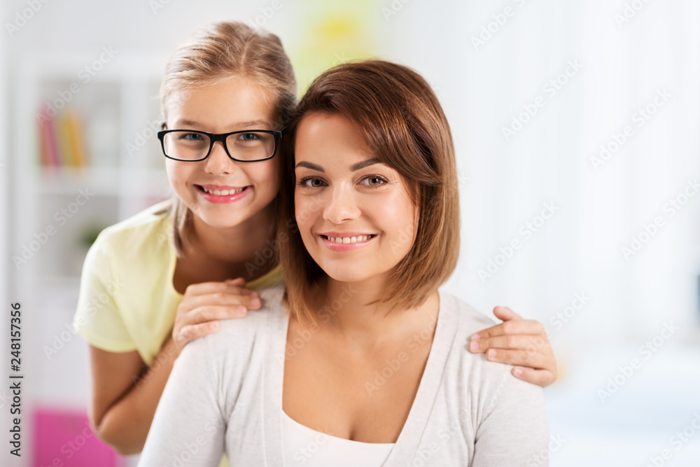 people and family concept - portrait of happy mother and daughter at home people and family concept - portrait of happy mother and daughter at home