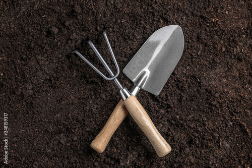 Gardening shovel with rake on soil