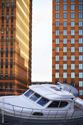 A boat stranded amongst modern office towers in central business district photo