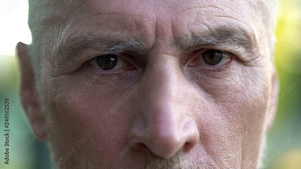 Old sad grandfather looking into camera, thinking about future, depression Old sad grandfather looking into camera, thinking about future, depression