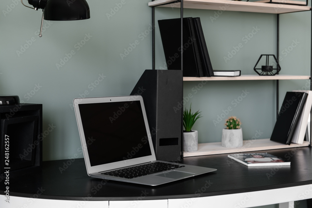 Comfortable workplace with modern laptop Comfortable workplace with modern laptop