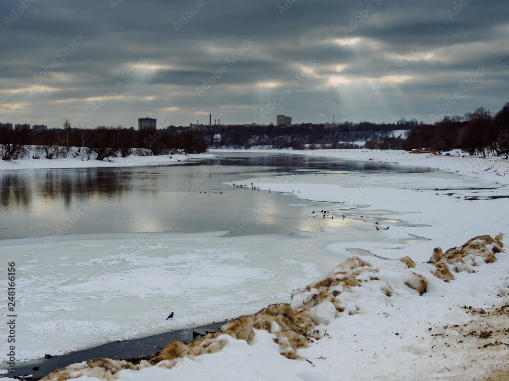 View of the Frozen River with Crowns on the Ice During Scenic Sawn at a Winter Day in Kolomenskoye Park, Moscow